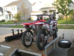 Lock-N-Load Moto Transport System - two mx bikes loaded into a trailer. no messy straps